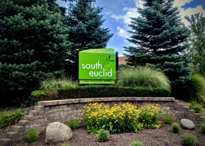 Exterior view of a monument sign with the text South Euclid Come Together and Thrive